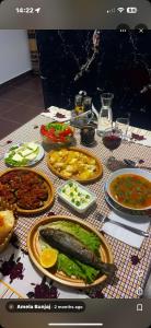 a table with many plates of food on it at Turi-Selcë in Selcë +56 photos