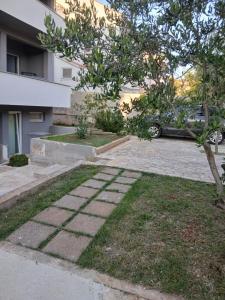 a car parked in front of a building at Ž apartmani in Zadar