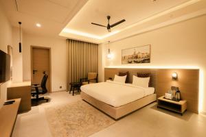 Ένα ή περισσότερα κρεβάτια σε δωμάτιο στο Hotel ADB Mansingh Inn