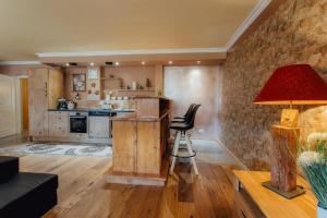 Kuchyň nebo kuchyňský kout v ubytování Appartement MONTY by MoniCare (Alpenresidenz Tirolia)