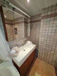 a bathroom with a sink and a mirror at Appartement THERESE by MoniCare in Seefeld in Tirol