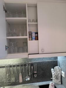 a kitchen cabinet with utensils on the counter at Appartement ALEXANDRA by MoniCare in Seefeld in Tirol