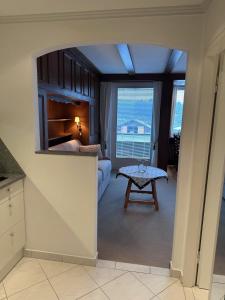 a living room with a bed and a table at Appartement ALEXANDRA by MoniCare in Seefeld in Tirol +26 photos