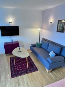 Posezení v ubytování Appartement DORIS mit Hallenbad und Sauna by MoniCare + 21 fotografií