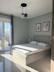 Ένα ή περισσότερα κρεβάτια σε δωμάτιο στο Deluxe Stay Villas