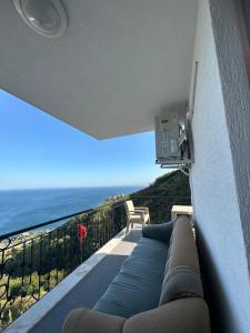 a balcony with a view of the ocean at Panorama villa in Akcaabat