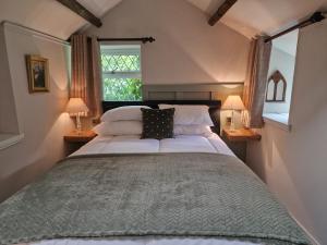 Voodi või voodid majutusasutuse The Stables Cottage at Glyn Isa toas