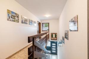 a staircase in a house with pictures on the walls at Apartment Am Wasen in Kirchheim unter Teck