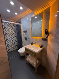 a bathroom with a sink and a toilet at City Hotel İstanbul in Istanbul