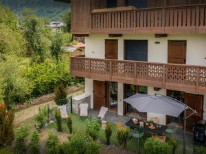 an overhead view of a balcony with an umbrella at Lodge Sami - OVO Network in Samoëns