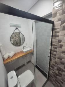 a bathroom with a sink and a mirror at Fortunato Hotel in Bragança Paulista +13 photos