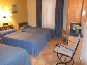 Voodi või voodid majutusasutuse Hotel Villa de Utrillas toas