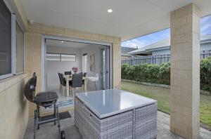 a kitchen and dining room with a table and chairs at Seascape Beach House Retreat in Falcon