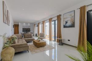 a living room with a couch and a table at Rocky 39 in Grand-Baie
