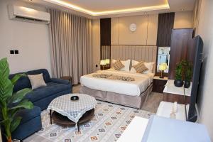 Giường trong phòng chung tại Aknan AlNarjs +6 ảnh