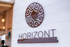 a chocolate donut sign on the side of a store at Residence Horizont in Margherita di Savoia