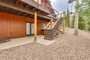 ein Haus mit einer Treppe an der Seite in der Unterkunft Hot Tub, Game Room! 3-Story Brian Head Home in Brian Head