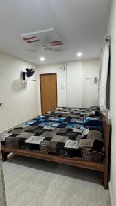 a bedroom with a bed in a room at Sumukha Premium PG For Womens in Hyderabad +2 photos