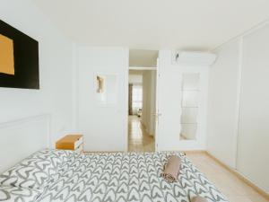 a white bedroom with a bed and a mirror at Spacious 2 BR Golden Apartment by Aqua Vista Tenerife in Callao Salvaje +75 photos