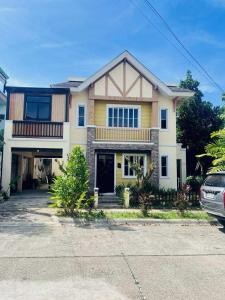a house with a car parked in front of it at El Jona De Residencia 2 in Davao City