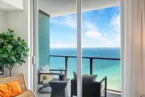 a balcony with a view of the ocean at PRICE REDUCED DUE TO FLOOR COSMETIC DAMAGE - Picturesque Beachfront Condo - LOVELY 2BD and 2BA APT WITH DIRECT OCEAN VIEW in Hollywood