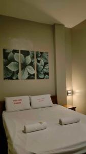 Ένα ή περισσότερα κρεβάτια σε δωμάτιο στο Wjv Inn Jugan Branch