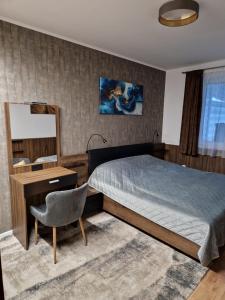 Ένα ή περισσότερα κρεβάτια σε δωμάτιο στο Tameli Delux Apartman