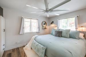 a bedroom with a bed and a ceiling fan at Half-Mi to Trails Pet-Friendly Home in Flagstaff! in Mountainaire