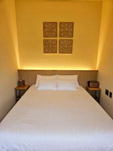 Ένα ή περισσότερα κρεβάτια σε δωμάτιο στο 제주 이루후제