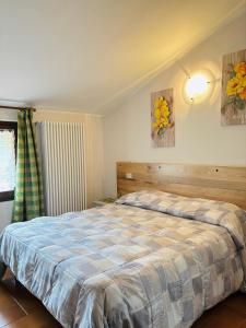 Postel nebo postele na pokoji v ubytování Agriturismo Cornei da Nadia + 10 fotografií