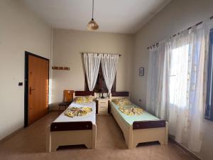 Katil atau katil-katil dalam bilik di Apartament Zani