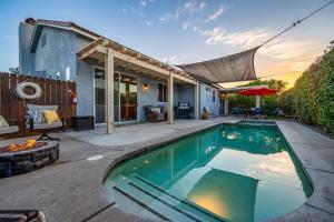 a swimming pool in the backyard of a house at Oasis in Indio, La Quinta with Private Pool & Spa in Indio