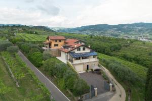 an aerial view of a house in a vineyard at Zardo Winery in San Pietro in Cariano