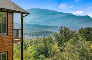 a house with a view of the mountains at Two Mountain Cabins with Views & Hot Tub Fun in Gatlinburg
