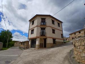 an old building on the side of a road at Encanto del Gregorio in Huerta del Marquesado