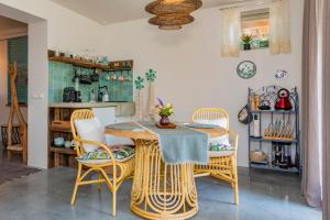 a dining room with a table and chairs at Mijn-Habitat in Valkenburg +14 photos
