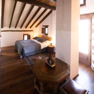 Ένα ή περισσότερα κρεβάτια σε δωμάτιο στο Casa Arbolitos Rooms & Garden