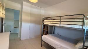 a room with two bunk beds and a hallway at Tu Paraíso Privado Con Piscina in Albolote +37 photos