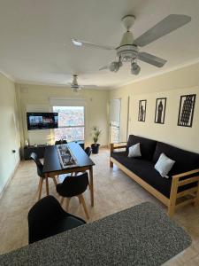 a living room with a couch and a table at Departamento centrico Avenida Cordoba Edificio Campanarios XIX in Esperanza