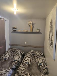 a room with a bed with a tiger head on it at Charmant Mobil home avec piscine privative in Gémenos