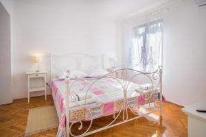 Postel nebo postele na pokoji v ubytování Apartments Rose