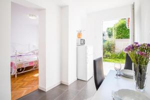 Postel nebo postele na pokoji v ubytování Apartments Rose