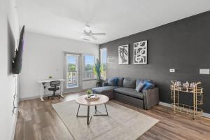 a living room with a couch and a table at Upscale King 2BR Suite Mins Uptown Charlotte in Charlotte