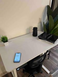 a desk with a tablet sitting on top of it at Upscale King 3 Bed Suite to Uptown Charlotte in Charlotte +11 photos