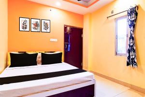 Ένα ή περισσότερα κρεβάτια σε δωμάτιο στο Hotel O CITY PLACE