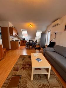 a living room with a couch and a table at Апартаменты in Biely Kostol