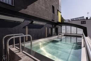 a swimming pool on the side of a building at Villa Buki Pokoje & SPA in Jastrzębia Góra
