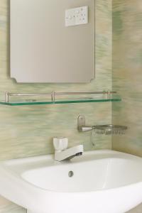 a bathroom with a white tub and a mirror at South View residence 02 in Busse +28 photos