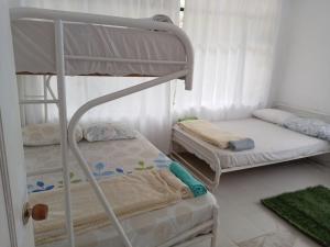 a bedroom with two bunk beds at cabaña vacacional prado tolima in Prado +13 photos