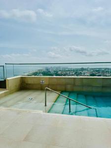 a swimming pool on the roof of a building at Villas del mar in Cartagena de Indias